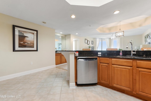 2668 Beach Blvd Unit 304, Biloxi, MS 39531 - kitchen featuring stainless steel dishwasher, a sink, brown cabinetry, recessed lighting, and hanging light fixtures