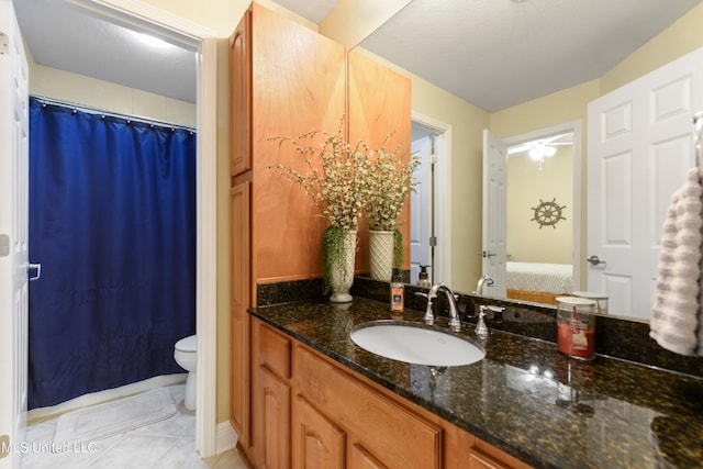 2668 Beach Blvd Unit 304, Biloxi, MS 39531 - ensuite bathroom with toilet, vanity, tile patterned floors, and curtained shower