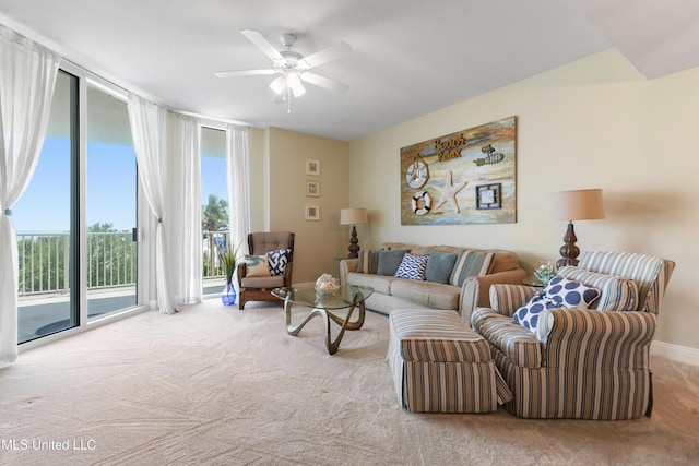 2668 Beach Blvd Unit 304, Biloxi, MS 39531 - carpeted living room featuring healthy amount of natural light, a ceiling fan, baseboards, and a wall of windows