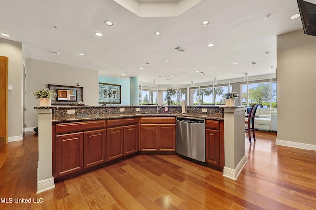 2668 Beach Blvd Unit 304, Biloxi, MS 39531 - kitchen featuring dishwasher, recessed lighting, wood finished floors, open floor plan, and baseboards