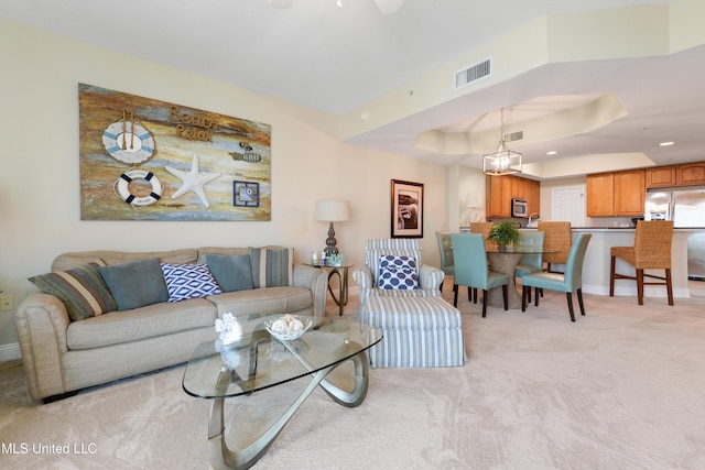 2668 Beach Blvd Unit 304, Biloxi, MS 39531 - living room featuring a tray ceiling, light colored carpet, baseboards, and recessed lighting