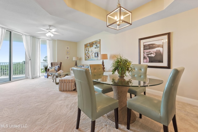 2668 Beach Blvd Unit 304, Biloxi, MS 39531 - dining space featuring carpet, a chandelier, a ceiling fan, and baseboards