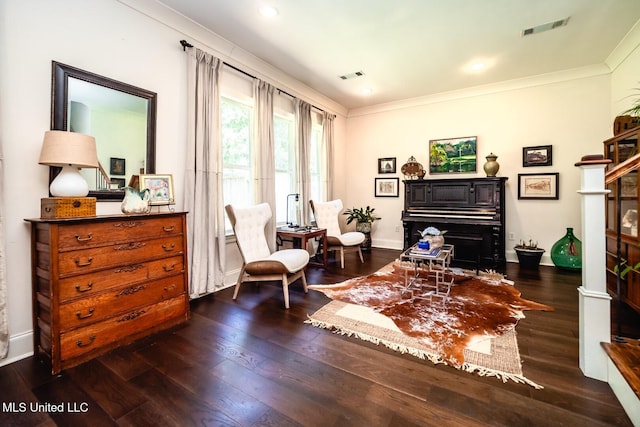 sitting room featuring dark hardwood / wood-style flooring and crown molding