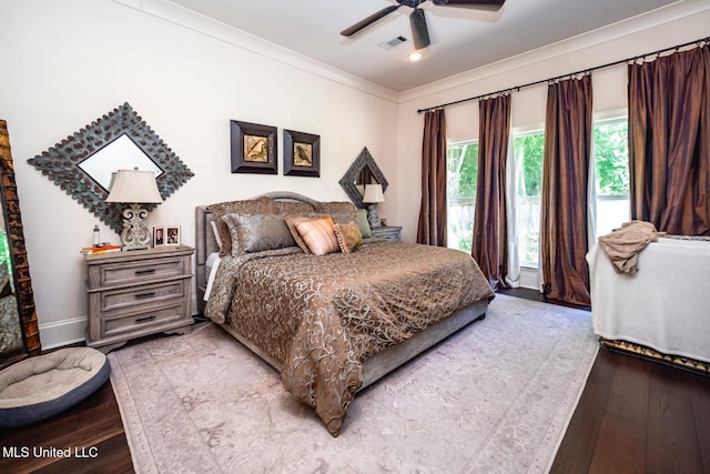 bedroom featuring crown molding, ceiling fan, and light hardwood / wood-style flooring