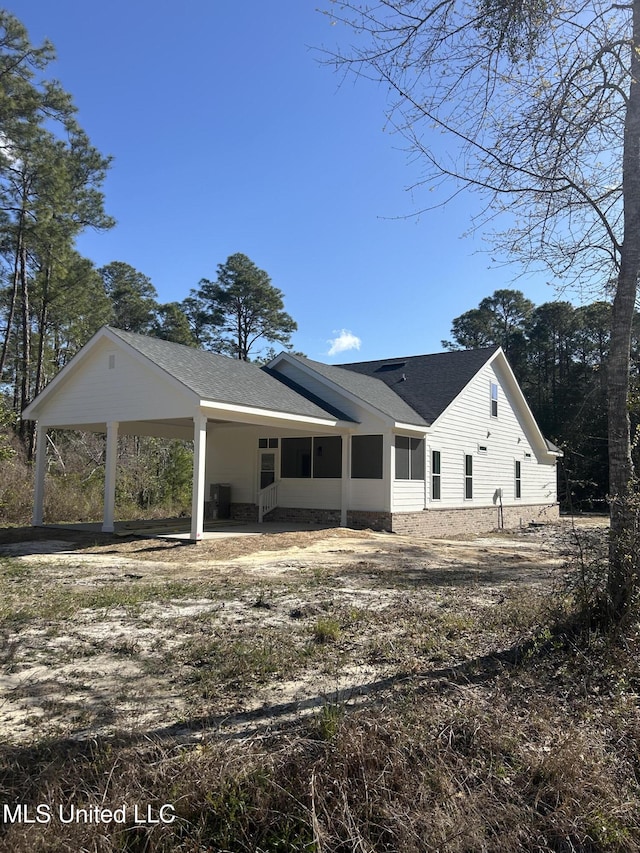 exterior space with a shingled roof