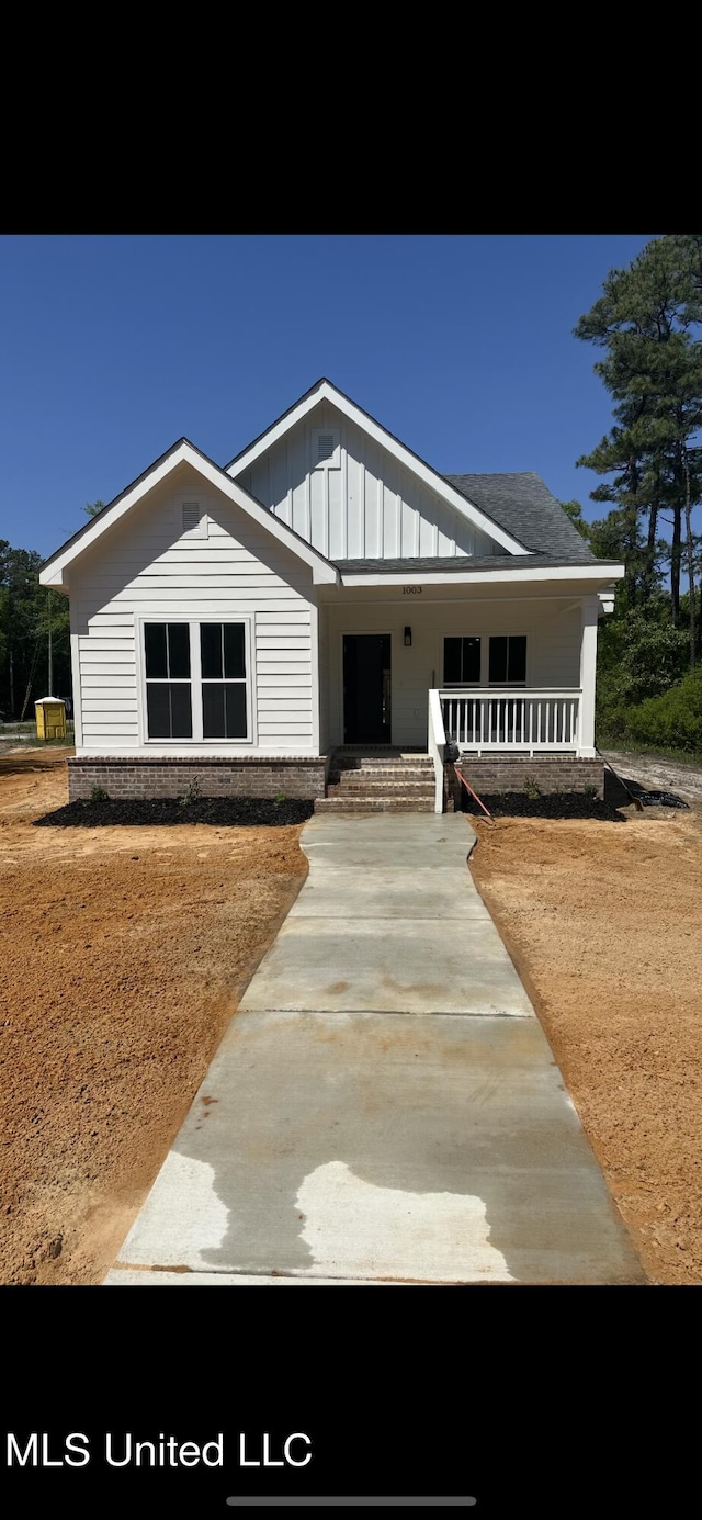 view of front facade featuring board and batten siding and a porch