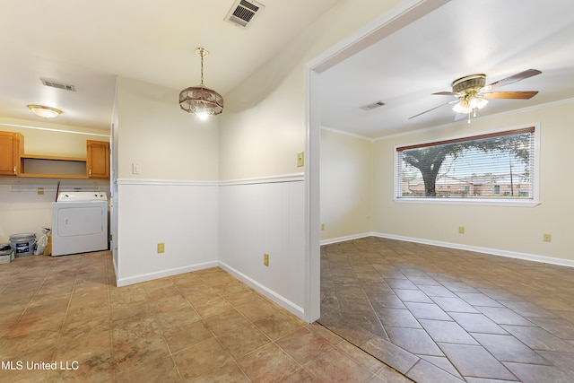 interior space featuring ceiling fan, washer / dryer, and crown molding