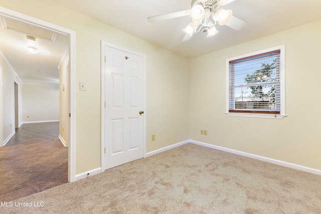 carpeted empty room with ceiling fan