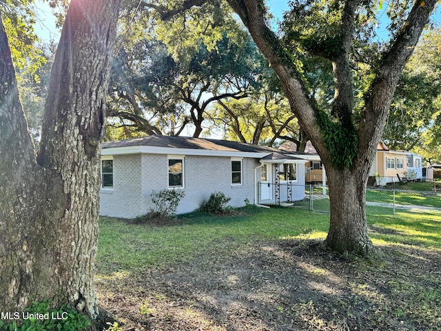 exterior space with a yard