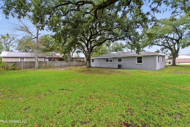 view of yard with central AC