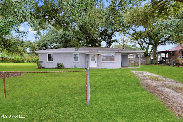 ranch-style home with a front lawn and a carport