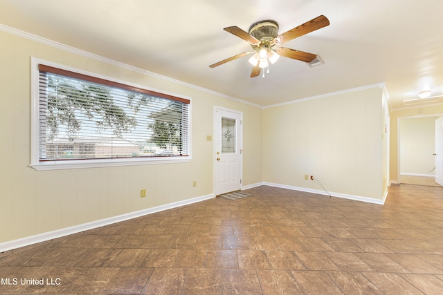 spare room featuring ceiling fan and ornamental molding