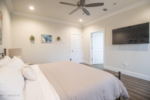 bedroom featuring dark wood-type flooring, ceiling fan, and ornamental molding