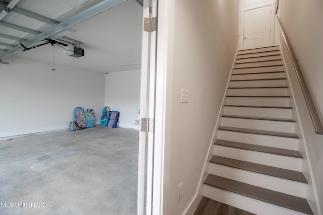 staircase with concrete floors