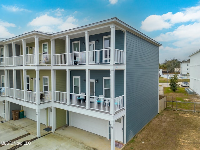 view of property exterior featuring a garage and a balcony