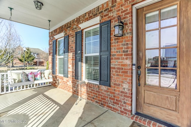 property entrance with covered porch