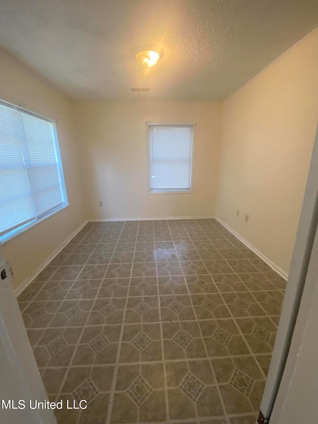 view of tiled spare room