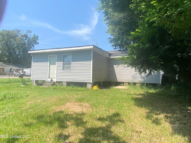 view of property exterior featuring a yard