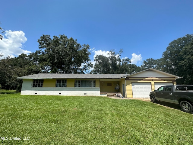 single story home featuring a front yard and a garage