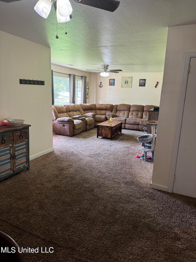 living room featuring carpet, a textured ceiling, and ceiling fan