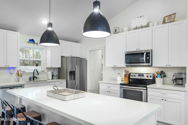 kitchen featuring a sink, white cabinetry, stainless steel appliances, and light countertops