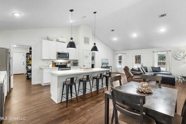 dining room with high vaulted ceiling, baseboards, visible vents, and dark wood finished floors