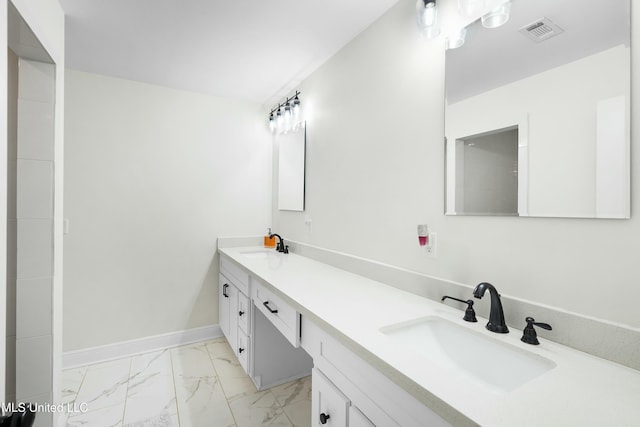 full bath featuring double vanity, marble finish floor, visible vents, and a sink