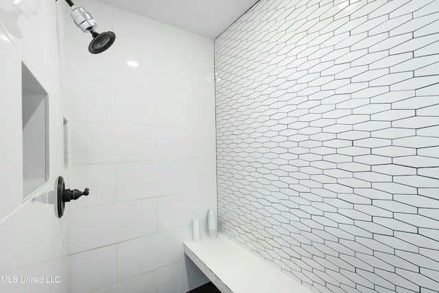 full bathroom with tiled shower