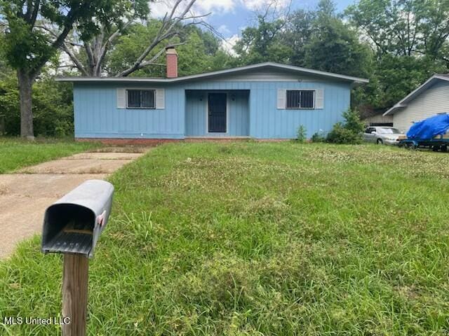 2804 Revere St, Jackson, MS 39212 - ranch-style house featuring a chimney and a front lawn