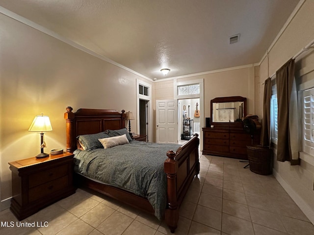 515 Krebs Ave, Pascagoula, MS 39567 - bedroom with crown molding and light tile patterned floors