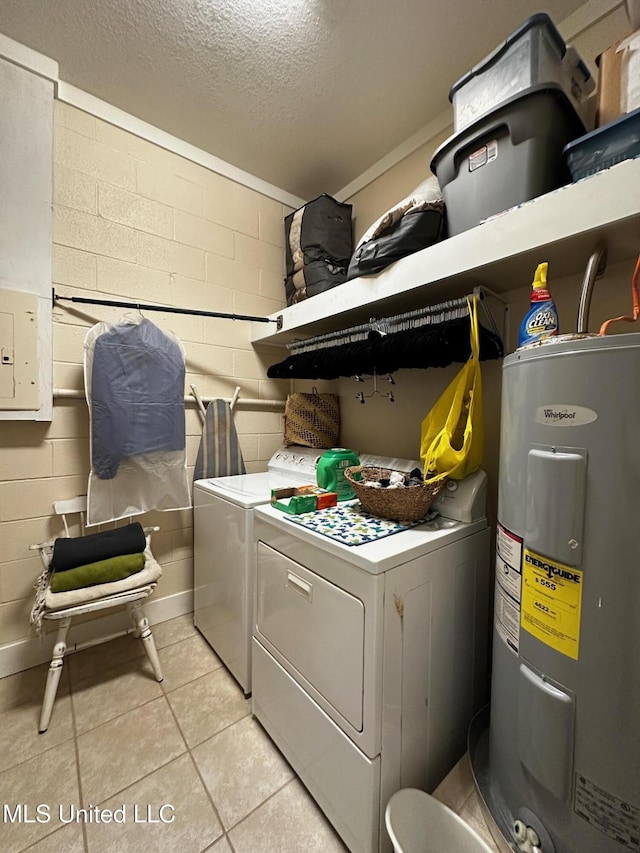 515 Krebs Ave, Pascagoula, MS 39567 - laundry room with electric water heater, washing machine and dryer, a textured ceiling, concrete block wall, and light tile patterned floors