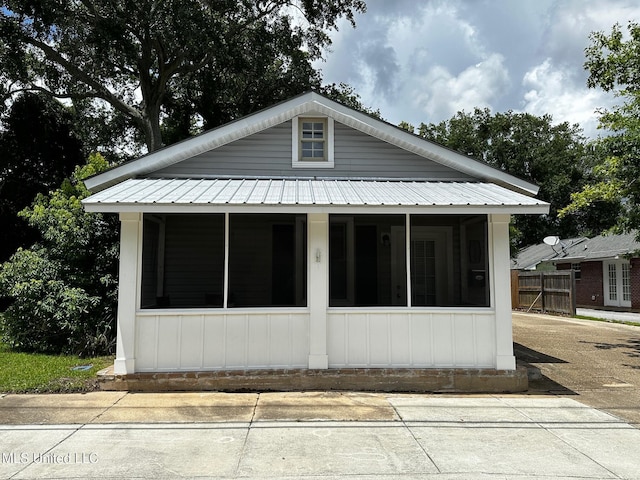 515 Krebs Ave, Pascagoula, MS 39567 - view of side of home featuring a metal roof and a sunroom