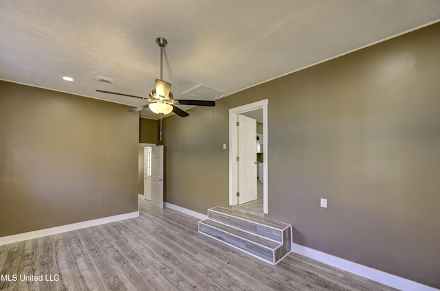 223 Second Ave, Vicksburg, MS 39183 - spare room with ceiling fan, light wood-type flooring, and a textured ceiling