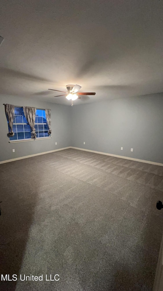 carpeted empty room with ceiling fan