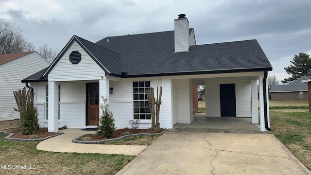 view of front of home with a carport