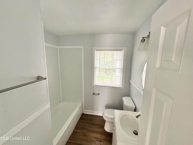 full bathroom featuring vanity, tub / shower combination, hardwood / wood-style floors, and toilet