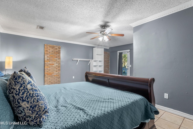 tiled bedroom with a textured ceiling, ceiling fan, and crown molding