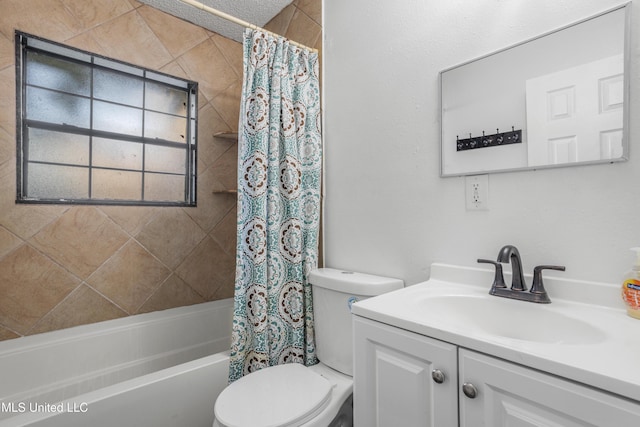 full bathroom featuring toilet, vanity, and shower / tub combo with curtain