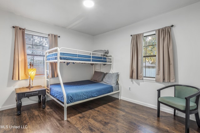 bedroom featuring dark wood-type flooring