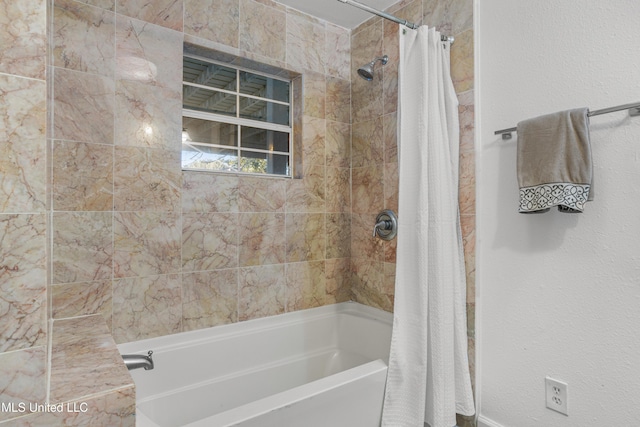 bathroom featuring shower / bathtub combination with curtain