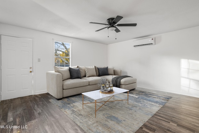 living room with ceiling fan, an AC wall unit, and dark wood-type flooring