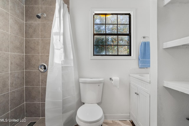 bathroom with a shower with shower curtain, vanity, and toilet