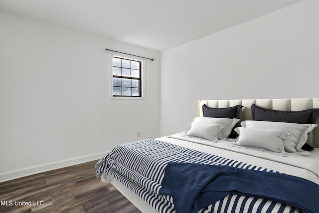 bedroom featuring dark hardwood / wood-style flooring