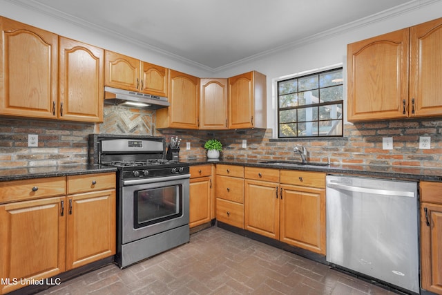 kitchen with sink, stainless steel appliances, backsplash, crown molding, and dark stone counters