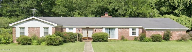 1173 NW Ave, Durant, MS 39063 - single story home with a front yard, a chimney, and brick siding