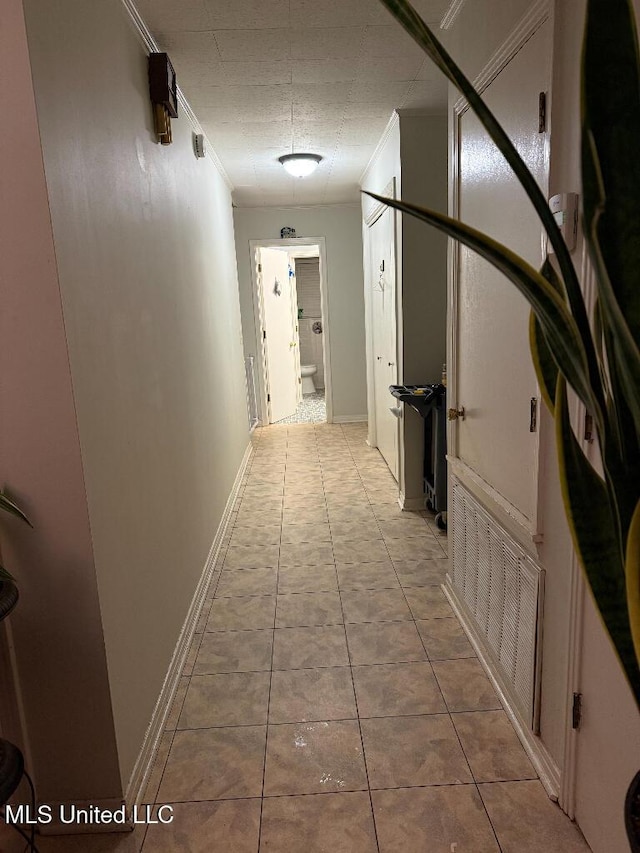 1173 NW Ave, Durant, MS 39063 - corridor with crown molding and tile patterned floors