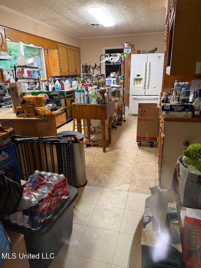 1173 NW Ave, Durant, MS 39063 - kitchen with white refrigerator with ice dispenser, an ornate ceiling, and brown cabinetry