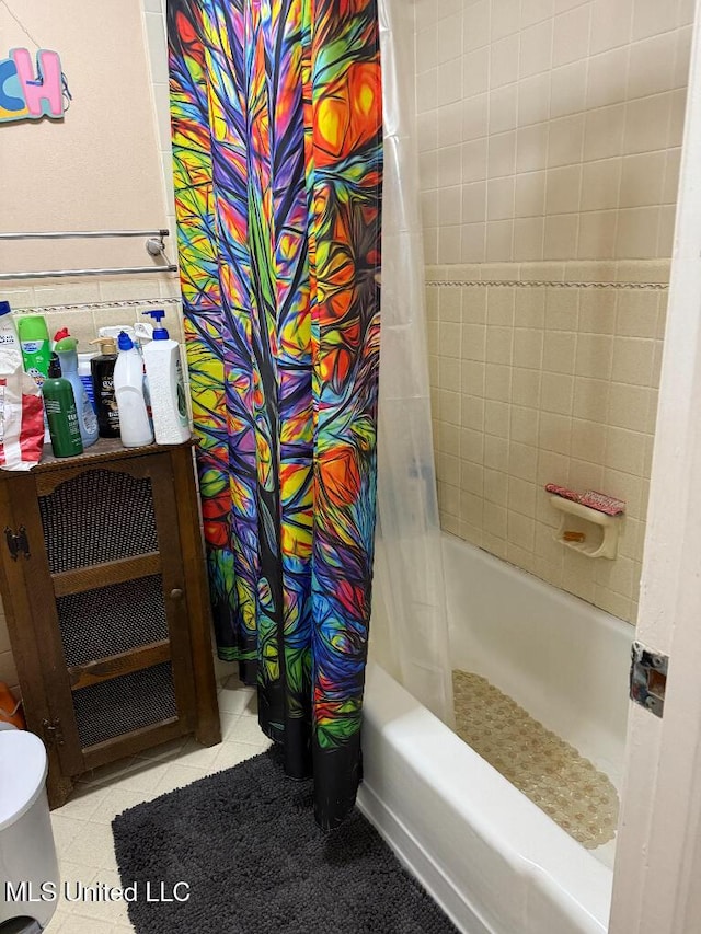 1173 NW Ave, Durant, MS 39063 - full bathroom with tile patterned floors and shower / bathtub combination with curtain