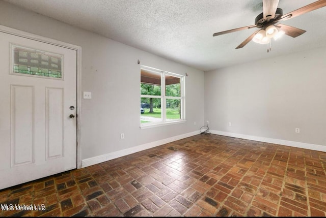 4127 Ceolia Taylor Rd, Moss Point, MS 39562 - entryway with baseboards, brick floors, ceiling fan, and a textured ceiling