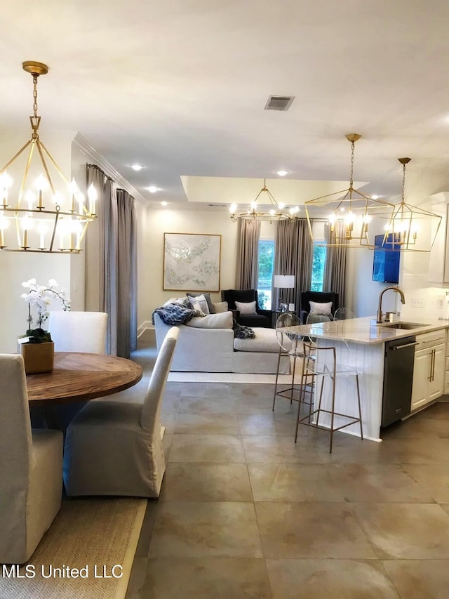 dining space featuring an inviting chandelier and visible vents